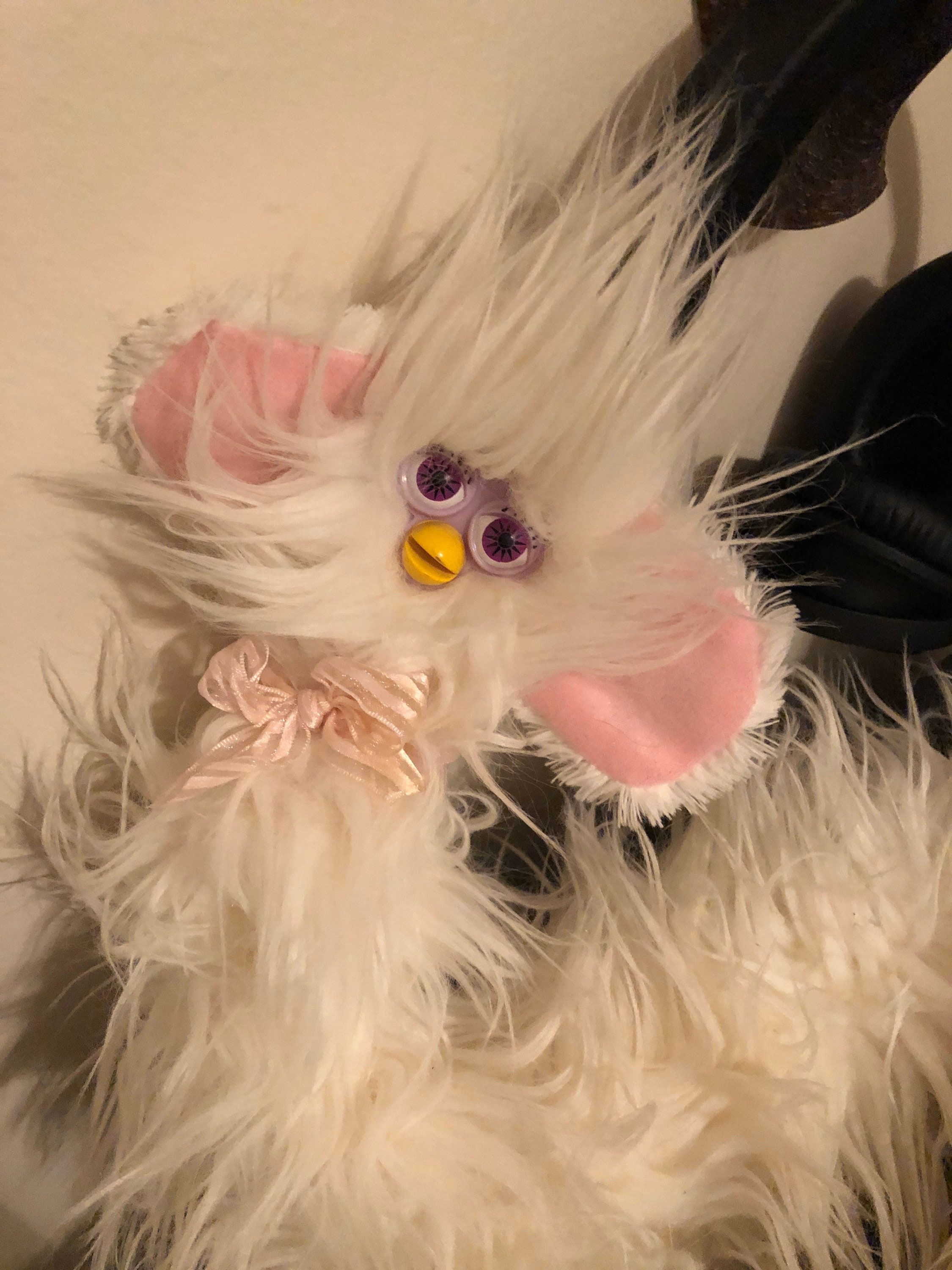 white fluffy oddbody long furby close up image