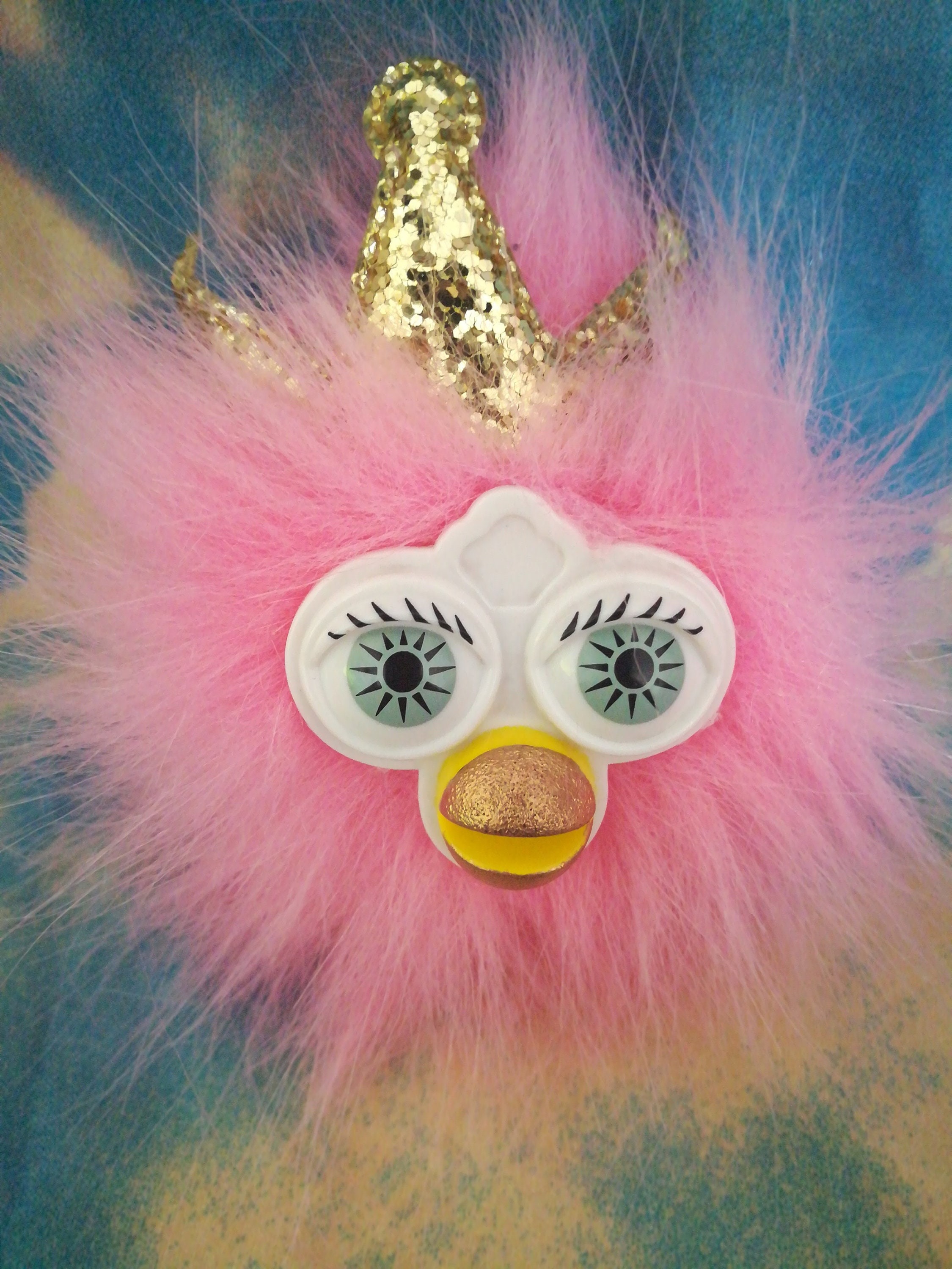 pink furby bag clip with a gold crown